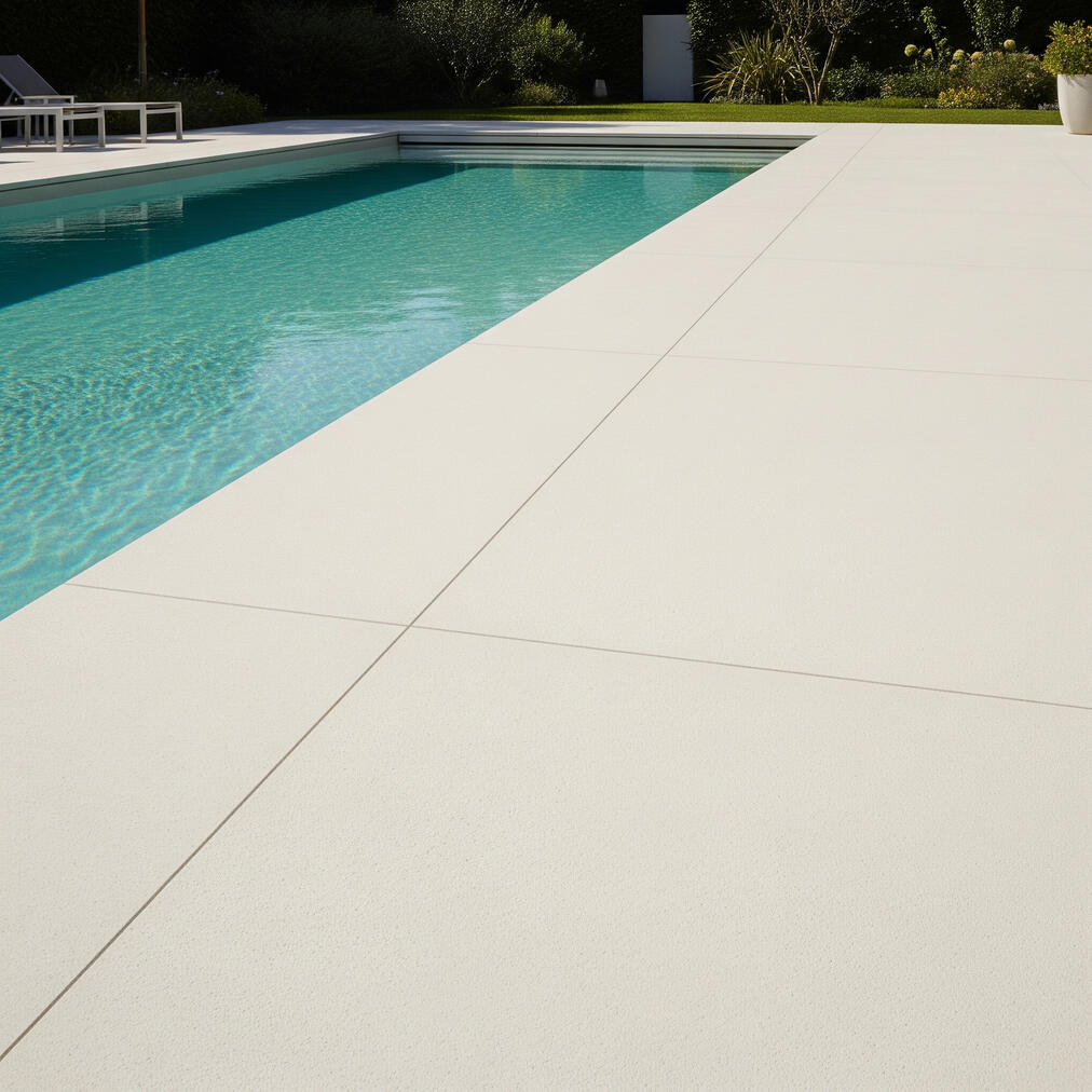 Untitled Concrete seating with firepit in the backyard with tables and chairs with privacy fence.